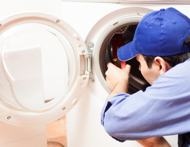 about_us Experienced appliance repair technician working on a washing machine in Meath
